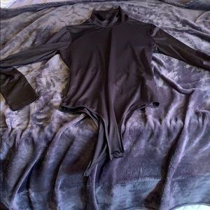 Black turtle neck body suit